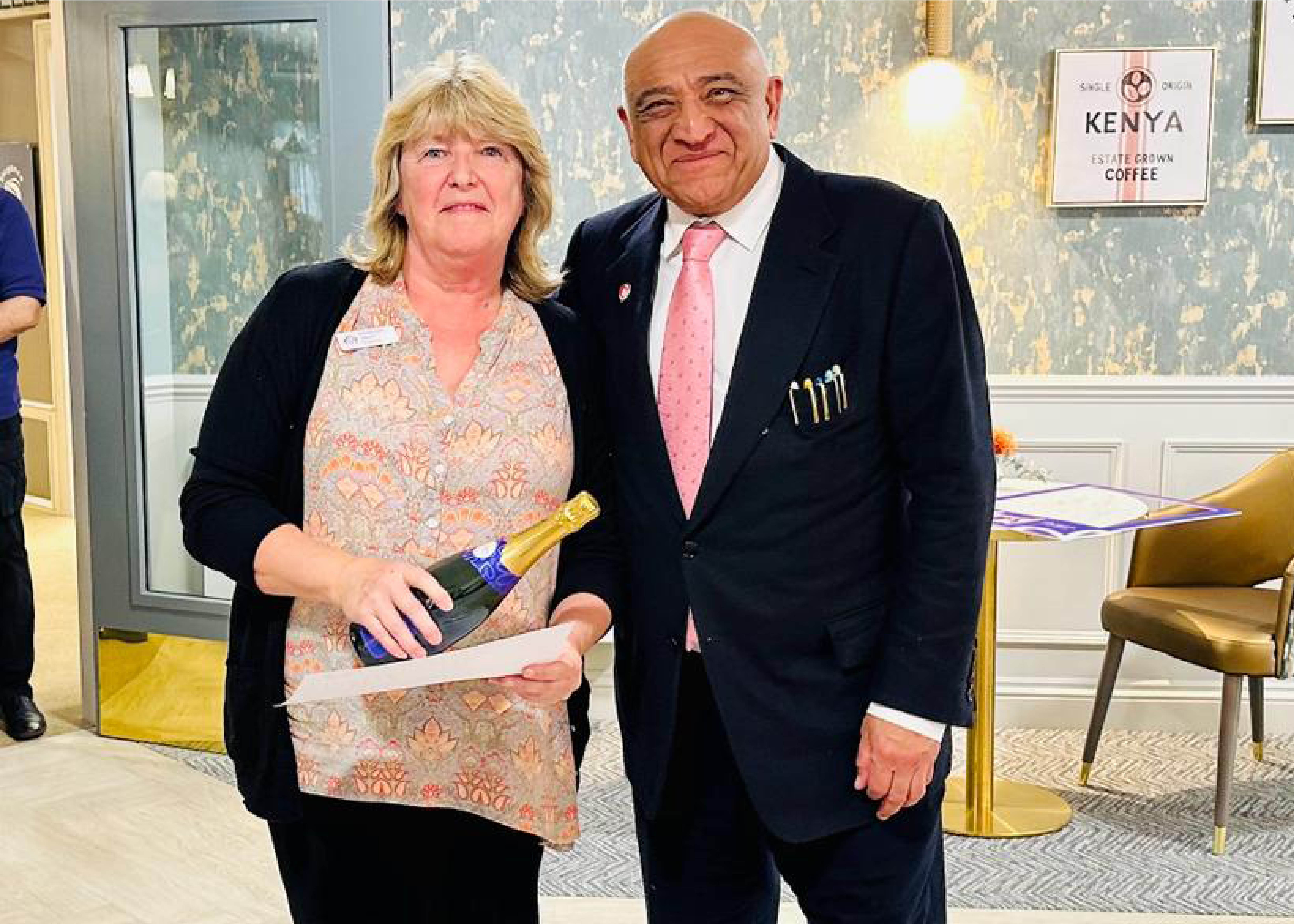 Employee of the month awarded to Receptionist Tracey Reed by Chairman Abdul Kachra